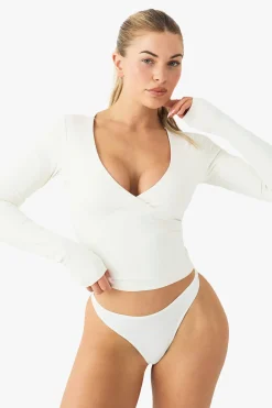 Haut sculptant ultra-doux à manches longues avec col en V et rembourrage intégré