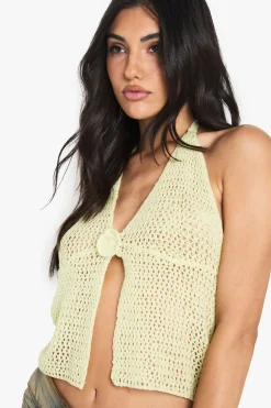 Haut tricoté flottant à détails floraux crochetés