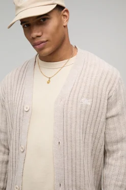 HOMME Cardigan tricoté en jacquard brodé, style varsity, à coupe boxy et motif floral