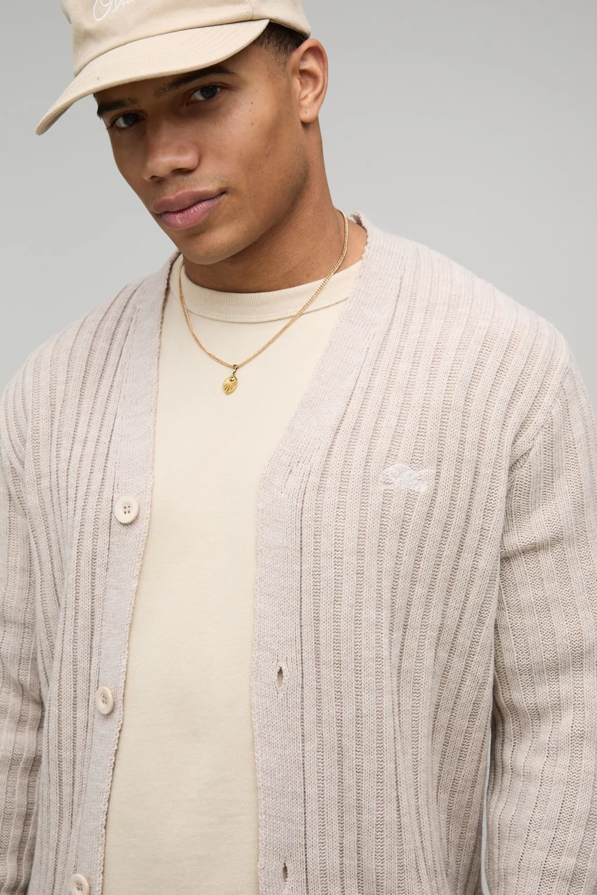 HOMME Cardigan tricoté en jacquard brodé, style varsity, à coupe boxy et motif floral