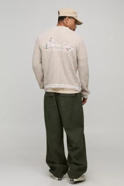 HOMME Cardigan tricoté en jacquard brodé, style varsity, à coupe boxy et motif floral