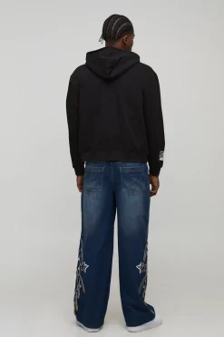 Hoodie à capuche zippé noir surdimensionné, à coupe carrée, imprimé avec des motifs de graffiti doodle