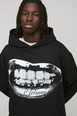 Hoodie graphique noir surdimensionné à strass et impression foil