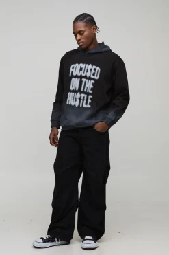 Hoodie noir oversize Hustle, à coutures lavées et imprimé