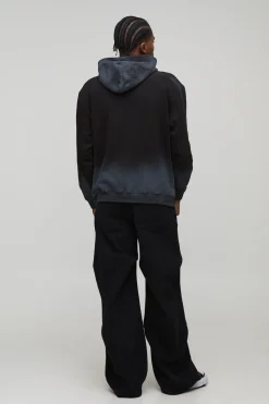 Hoodie noir oversize Hustle, à coutures lavées et imprimé