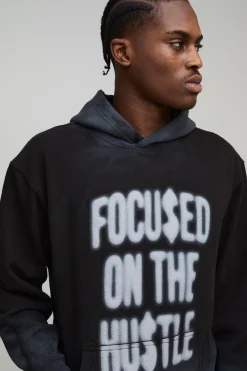 Hoodie noir oversize Hustle, à coutures lavées et imprimé