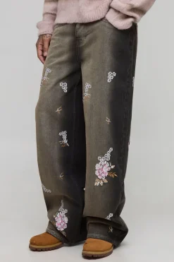 Jean ample, rigide, à motifs floraux brodés