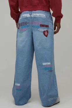 boohooMAN Jean Ample Teinté À Imprimé Graphique Attention Intégral<Homme Denim|Denim