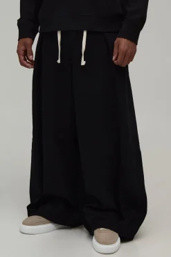 Jean À Ceinture Cordon Et Plis Ballons Extrêmes Sur Le Devant