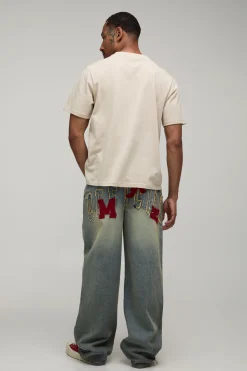 boohooMAN Jean Coupe Décontractée Avec Appliqués Varsity<Homme Denim|Denim