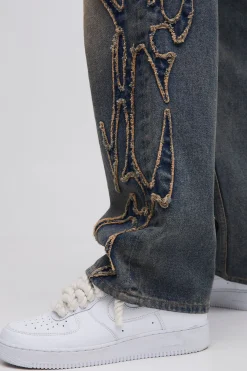 Jean à coupe décontractée, effet stone washed, avec appliqué tribal
