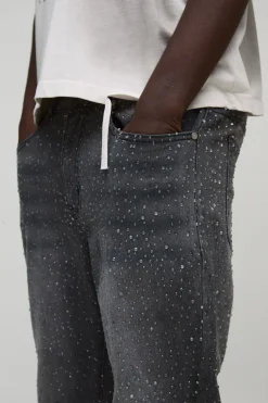 Jean denim slim évasé orné de strass clairs