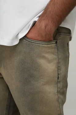 Jean grande taille, coupe slim, aux déchirures subtiles, teinté, avec ourlet abaissé