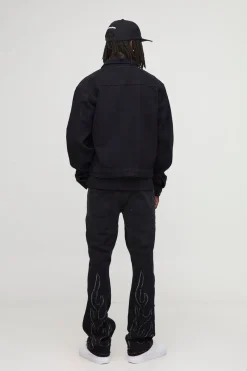 Jeans à appliqué flamme, coupe slim empilée et évasée