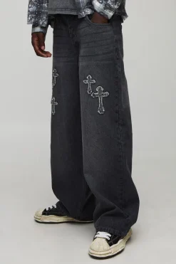 Jeans coupe baggy lavés à appliqué croisé