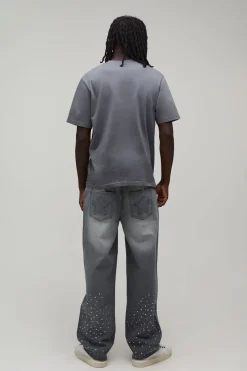 boohooMAN Jeans décontractés coupe relax avec poches ornées d'étoiles en strass sur toute la surface<Homme Denim|Denim