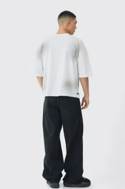 Jeans en denim baggy rigide à appliqué léopard croisé