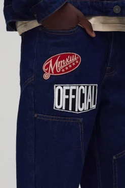 Jeans en denim Carpenter à coupe décontractée, jambe évasée et badge varsity
