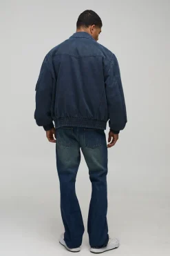 Jeans en denim à coupe superposée et évasée, ornés de strass disposés en croix