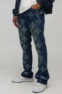 Jeans en denim à coupe superposée et évasée, ornés de strass disposés en croix