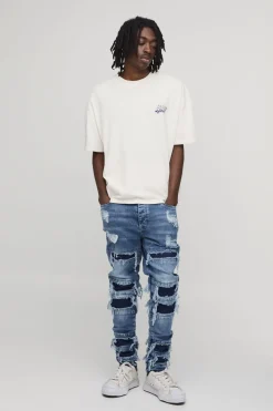 Jean Skinny Empilé Déchiré Et Réparé Délavé