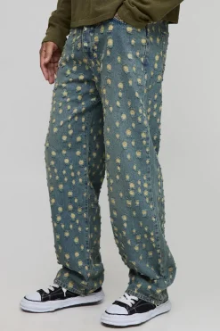 Jeans longs teintés, déchirés de façon extrême, coupe décontractée