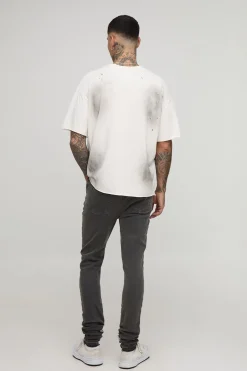 Jeans skinny pour grande taille, à ourlets empilés, usés et agrémentés d’un empiècement brodé