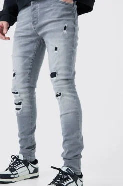 Jeans skinny stretch déchirés en lavage gris glace