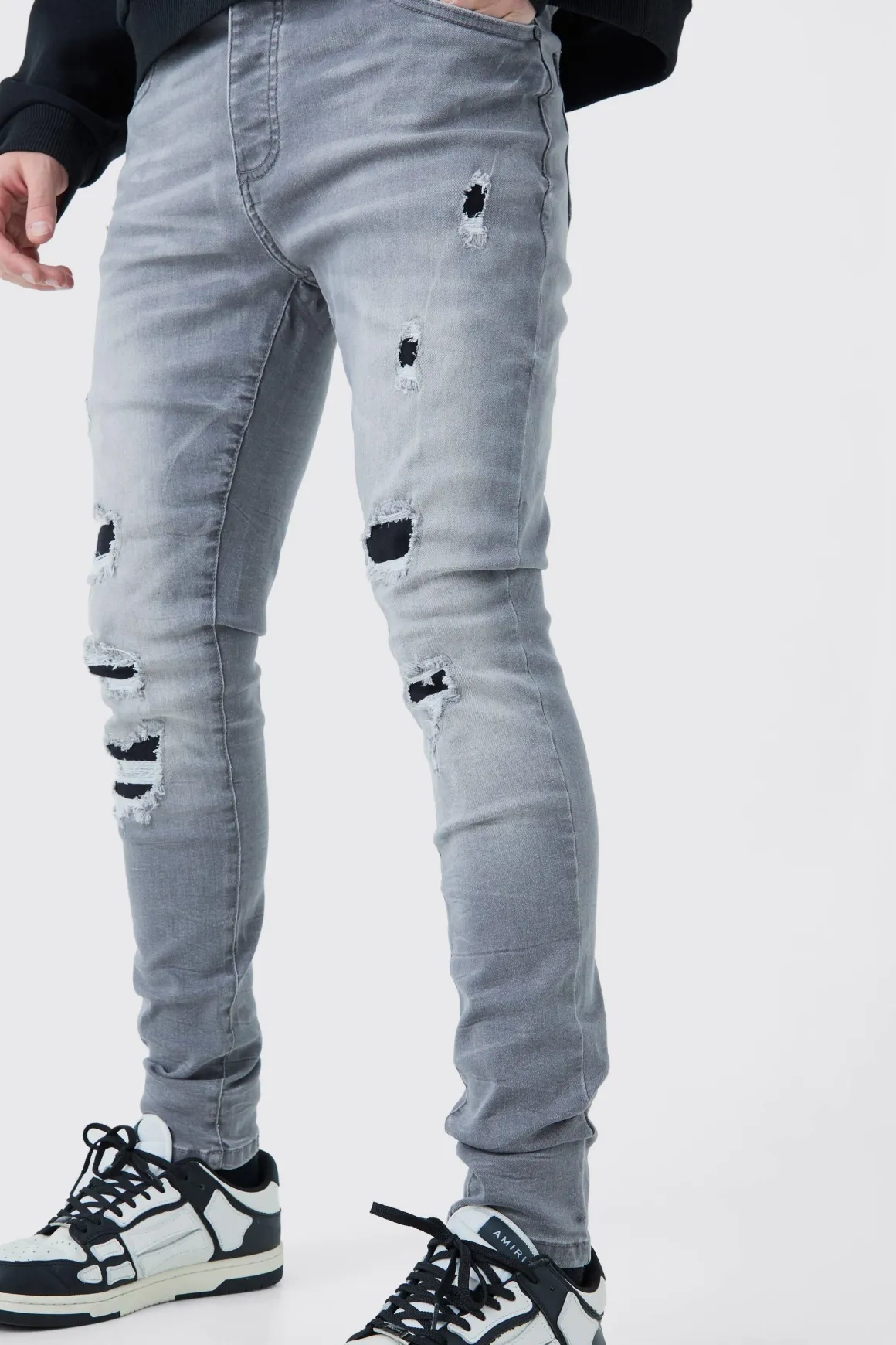 Jeans skinny stretch déchirés en lavage gris glace