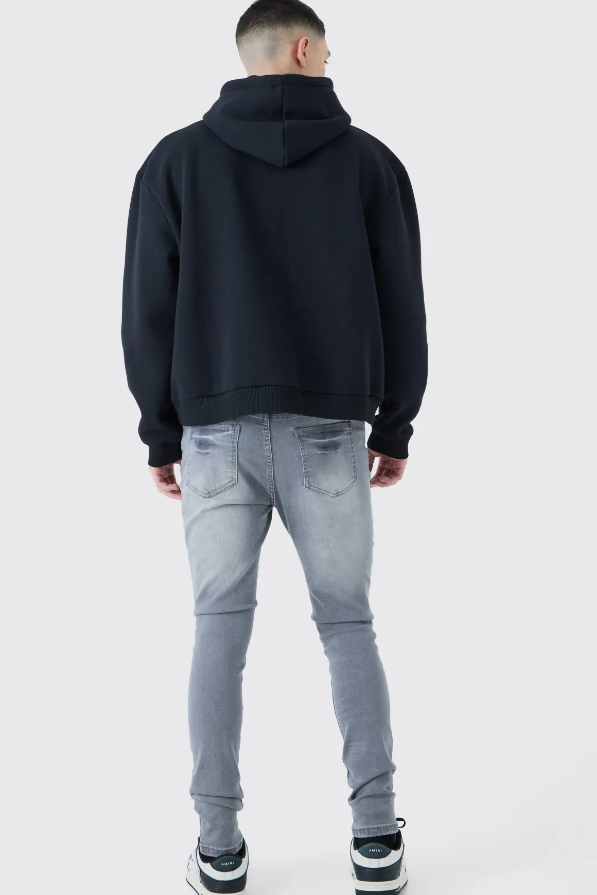 Jeans skinny stretch déchirés en lavage gris glace