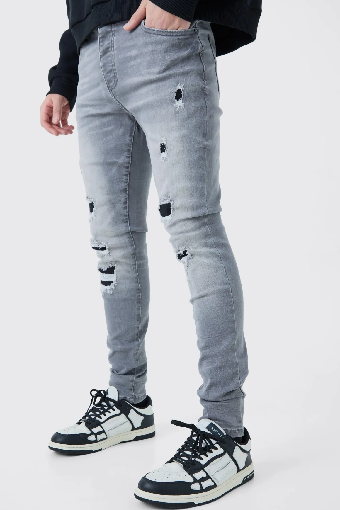Jeans skinny stretch déchirés en lavage gris glace