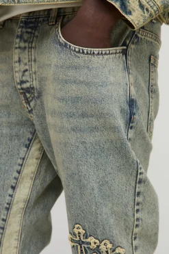 Jeans slim évasés à panneaux et appliqués croisés