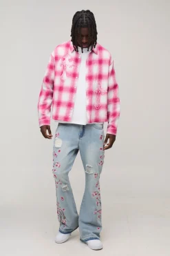 Jean Évasé Brodé Floral Effet Usé À Ourlet Défait