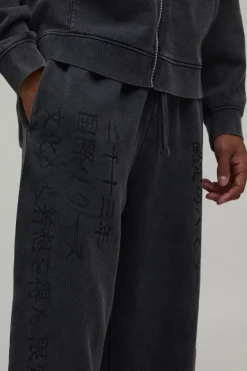 boohooMAN Jogger Délavé À Imprimé Graphique Coupe Large<Homme Joggings|Jogging