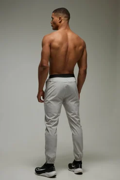 Jogger homme Active à ourlet zippé, chevets retroussés, coupe régulière