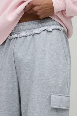 Jogger à jambes larges, poches cargo, système de réglage et taille brute