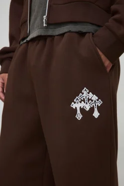 boohooMAN Joggers à jambes larges, imprimé vache et appliqué croisé<Homme Joggings|Jogging