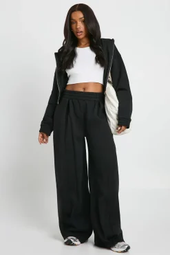 Jogger taille haute à détails plissés et jambe droite