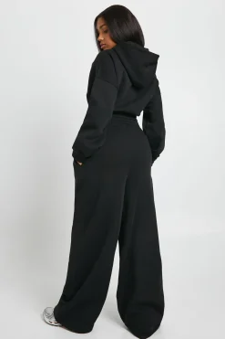 Jogger taille haute à détails plissés et jambe droite