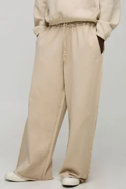 boohooMAN Joggeurs homme à jambes extra-larges, Loopback, script brodé, ourlet brut<Homme Joggings|Jogging