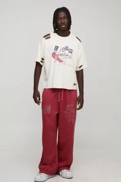 Joggeurs à jambes larges, entrejambe tombant, délavés, motif croisé Diamante
