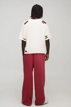 Joggeurs à jambes larges, entrejambe tombant, délavés, motif croisé Diamante