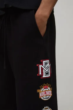 boohooMAN Jogging Coupe Baggy avec Badge Universitaire Imprimé<Homme Jogging|Tout Afficher