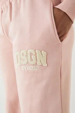 Jogging DSGN Studio en Tissu Éponge avec Appliqué Coupe Droite