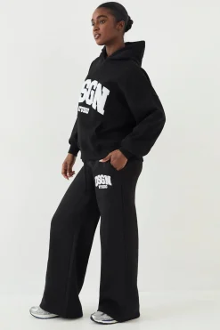 Jogging DSGN Studio en Tissu Éponge avec Appliqué Coupe Droite