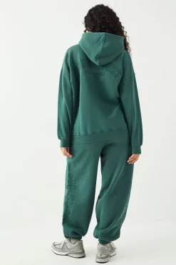 Jogging DSGN Studio Sport Training Club Coupe Oversize avec Chevilles Resserrées
