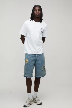 Jorts bleu déchirés à coupe régulière avec ourlet tombé