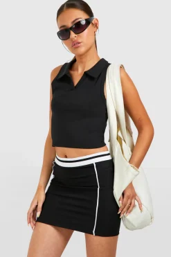 Jupe en tissu technique avec ceinture contrastée et passepoil