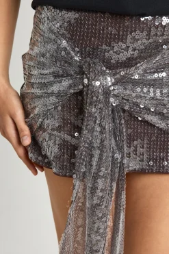 Jupe mini drapée à paillettes enveloppante