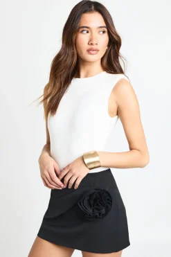 Jupe mini en crêpe twist aux détails roses